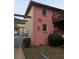 Pink and yellow two-story building with balconies and gated entry offers appealing urban living at 561 Formwalt Sw St # 12, Atlanta, GA 30312