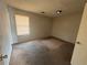 This bedroom features neutral paint and carpet, plus a window with blinds at 5676 Marbut Rd, Lithonia, GA 30058