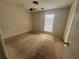 This bedroom has a window with blinds and neutral carpet at 5676 Marbut Rd, Lithonia, GA 30058