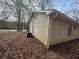 Exterior side view of home shows siding and an air conditioning unit at 5676 Marbut Rd, Lithonia, GA 30058