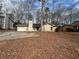 Charming single-story home with a cozy front yard and driveway at 5676 Marbut Rd, Lithonia, GA 30058