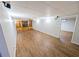 Finished basement offers wood-look floors and built-in shelving and cabinets at 6025 Ashbury Ln, Cumming, GA 30028