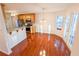 Eat-in kitchen featuring wood cabinets, granite countertops, and stainless steel appliances at 6025 Ashbury Ln, Cumming, GA 30028