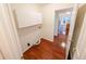 Convenient laundry room with storage and hardwood floors at 6025 Ashbury Ln, Cumming, GA 30028