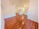 Spacious living area with gleaming hardwood floors and high ceilings at 6025 Ashbury Ln, Cumming, GA 30028
