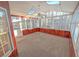 Bright sunroom featuring skylights and multiple windows at 6025 Ashbury Ln, Cumming, GA 30028