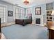 Inviting bedroom featuring a decorative fireplace and an elegant light fixture at 121 17Th Ne St, Atlanta, GA 30309