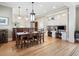 Open concept dining room and kitchen showcasing hardwood floors, built-ins, and desk space at 121 17Th Ne St, Atlanta, GA 30309