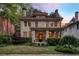 Stately stone home with lush landscaping, covered porch, and architectural details, perfect for curb appeal at 121 17Th Ne St, Atlanta, GA 30309