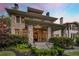 Inviting stone home with a covered front porch and meticulously landscaped yard at 121 17Th Ne St, Atlanta, GA 30309