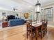Open-concept living room and dining area, bathed in natural light with hardwood floors and stylish furnishings at 121 17Th Ne St, Atlanta, GA 30309