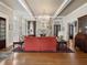 Spacious living room with hardwood floors, chandelier, and fireplace, offering a cozy atmosphere at 121 17Th Ne St, Atlanta, GA 30309