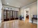 Well-lit living space featuring hardwood floors, large glass doors, and neutral paint at 121 17Th Ne St, Atlanta, GA 30309