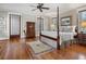 Traditional-style main bedroom featuring a four-poster bed, hardwood floors, and natural light at 121 17Th Ne St, Atlanta, GA 30309