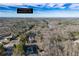 Aerial view of a property in Douglasville, GA, nestled in a wooded area near a lake at 17 Vickers Pl, Douglasville, GA 30134