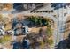 An aerial view of a suburban neighborhood with winding roads and tree-lined streets at 17 Vickers Pl, Douglasville, GA 30134