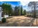 A manicured lawn with plenty of green space and mature trees providing privacy at 17 Vickers Pl, Douglasville, GA 30134