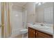 Standard bathroom featuring a shower-tub combo with a white shower curtain, toilet, and sink with vanity at 17 Vickers Pl, Douglasville, GA 30134