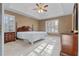 Spacious bedroom with tray ceilings, neutral walls, and plantation shutters for a bright and airy atmosphere at 17 Vickers Pl, Douglasville, GA 30134