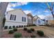 Charming two-story home boasts white siding, stone accents, and beautifully landscaped front yard under a blue sky at 17 Vickers Pl, Douglasville, GA 30134