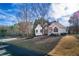 Lovely home with a well-manicured lawn and mature trees creating a serene setting next to the neighborhood playground at 17 Vickers Pl, Douglasville, GA 30134