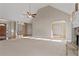 Bright living room featuring a stone fireplace, high ceilings, and lots of natural light at 17 Vickers Pl, Douglasville, GA 30134