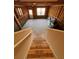 Unfinished basement with studded walls, and natural light from two windows and an access door at 1935 Manor Pointe Dr, Cumming, GA 30041