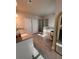 Bathroom with granite countertops, dual sinks, tub, and a glass-enclosed shower at 1935 Manor Pointe Dr, Cumming, GA 30041