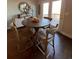 Cozy breakfast nook area with hardwood floors, view to the deck, and seating for four at 1935 Manor Pointe Dr, Cumming, GA 30041