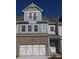 Charming townhome showcasing a brick facade and a private balcony at 1935 Manor Pointe Dr, Cumming, GA 30041
