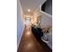 Elegant hallway featuring hardwood floors, stylish decor, and plenty of natural light at 1935 Manor Pointe Dr, Cumming, GA 30041