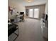 Spacious home office with ample natural light, modern desk, and neutral carpet at 1935 Manor Pointe Dr, Cumming, GA 30041