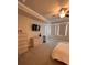 Spacious bedroom with a large bed, dresser, and TV, offering a comfortable and stylish living space at 1935 Manor Pointe Dr, Cumming, GA 30041