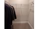 Empty walk-in closet with wire shelving and neutral-colored walls ready for a personalized organizing system at 1935 Manor Pointe Dr, Cumming, GA 30041