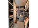 Organized walk-in closet featuring custom gray shelving, drawers, and a variety of storage options at 1935 Manor Pointe Dr, Cumming, GA 30041