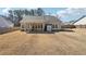 Large backyard with a covered patio, fenced-in yard, storage shed, and lush greenery at 2808 Blandwood Rd, Marietta, GA 30064