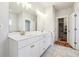 Bathroom with a shower, double sink vanity, and view into the walk-in closet at 2808 Blandwood Rd, Marietta, GA 30064