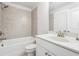Bathroom showcasing a tub-shower combination with light-colored tiles and a vanity at 2808 Blandwood Rd, Marietta, GA 30064