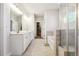 Bathroom with a shower, bathtub, and double sink vanity with neutral tile flooring at 2808 Blandwood Rd, Marietta, GA 30064