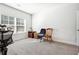 Bedroom with a large window, gray carpet, an office chair, and a small desk at 2808 Blandwood Rd, Marietta, GA 30064