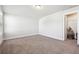 Bright bedroom with neutral walls, carpet, and a walk-in closet at 2808 Blandwood Rd, Marietta, GA 30064