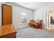 Neutral bedroom with a table and chairs, natural light from the window, and a light-colored carpet at 2808 Blandwood Rd, Marietta, GA 30064