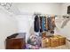 Walk-in closet with wire shelving, hanging clothes, and boxes on the floor at 2808 Blandwood Rd, Marietta, GA 30064