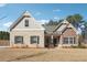 Charming single-Gathering home with a combination brick and stone facade, complemented by neat landscaping at 2808 Blandwood Rd, Marietta, GA 30064