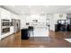 Modern kitchen with stainless steel appliances, a granite island, and sleek white cabinets at 2808 Blandwood Rd, Marietta, GA 30064