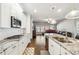 Open-concept kitchen with granite countertops, stainless steel appliances, and hardwood floors at 2808 Blandwood Rd, Marietta, GA 30064