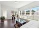 Bright living room with lots of windows, hardwood flooring, and a large sectional couch at 2808 Blandwood Rd, Marietta, GA 30064