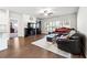 Spacious living room with ample natural light, hardwood floors, and a stylish entertainment center at 2808 Blandwood Rd, Marietta, GA 30064