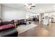Open concept living room featuring hardwood floors, ceiling fan, and adjacent kitchen with stainless steel appliances at 2808 Blandwood Rd, Marietta, GA 30064