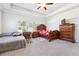 Large main bedroom with a tray ceiling, two beds, and ornamental, dark wood furniture at 2808 Blandwood Rd, Marietta, GA 30064